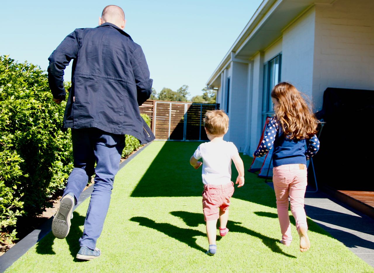 This is a photo of Matt having a foot race with our niece and nephew. They're the cutest little kids. 